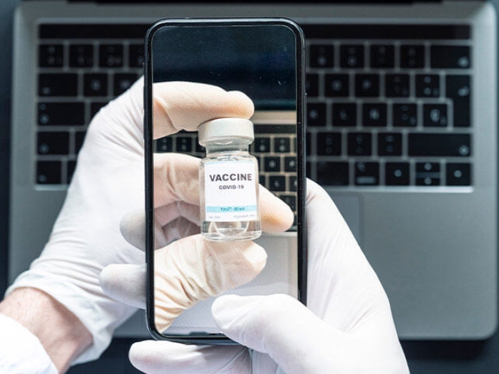 Iphone taking photo of vaccine