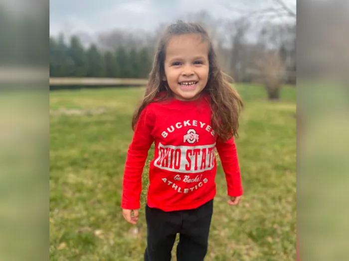 little girl in red shirt