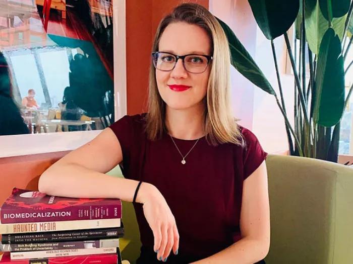 Photo of student with books