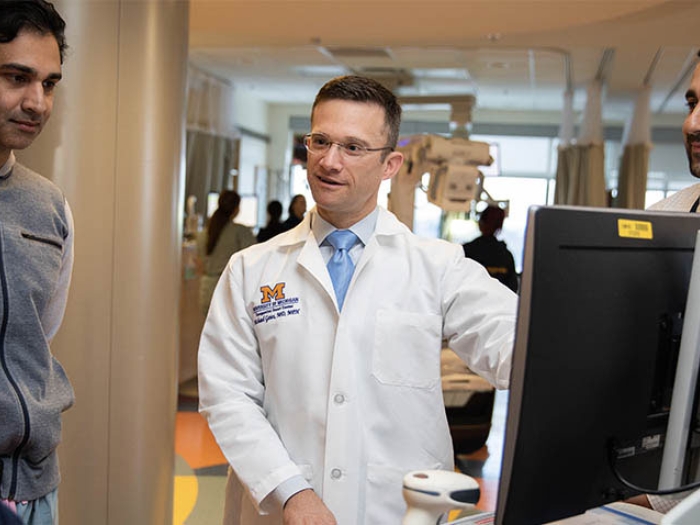 Doctor speaking with colleagues image