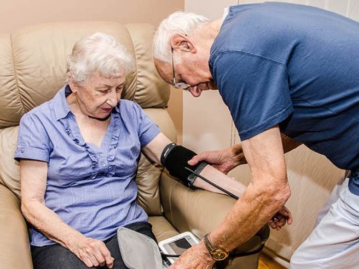 Older couple taking blood pressure