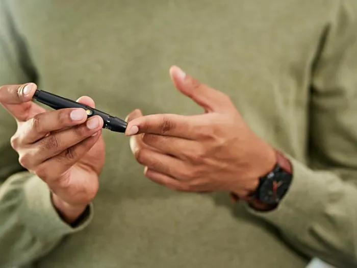 Person pricking finger