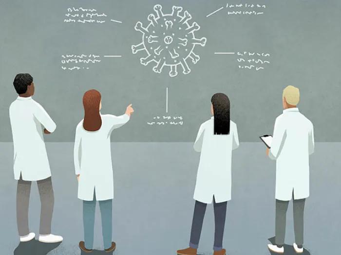 researchers looking at covid particle on chalkboard