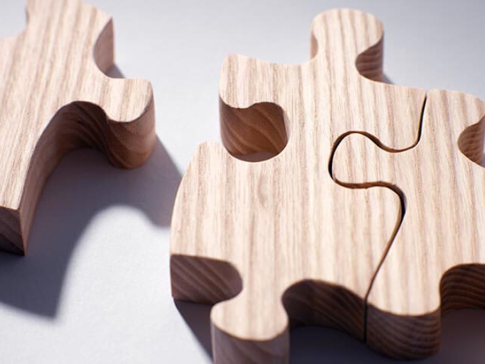 Three wooden puzzle pieces