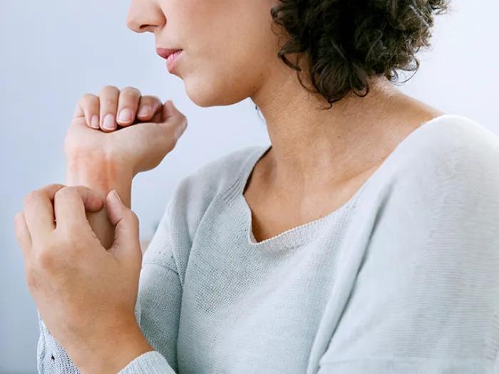 woman holding her wrist