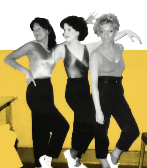 Three medical students pose in dance wear. They are rehearsing for a Galens Smoker spoof show in the 1980s.