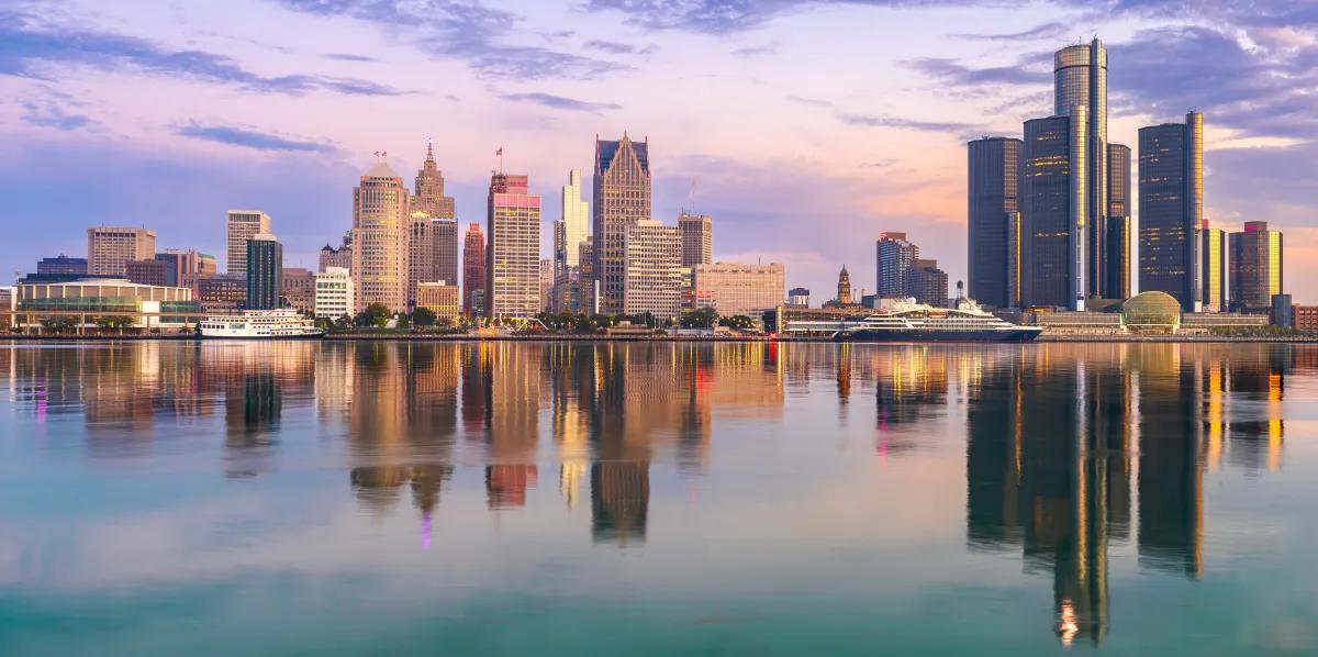 An image of Detroit's skyline, reflected in the river.