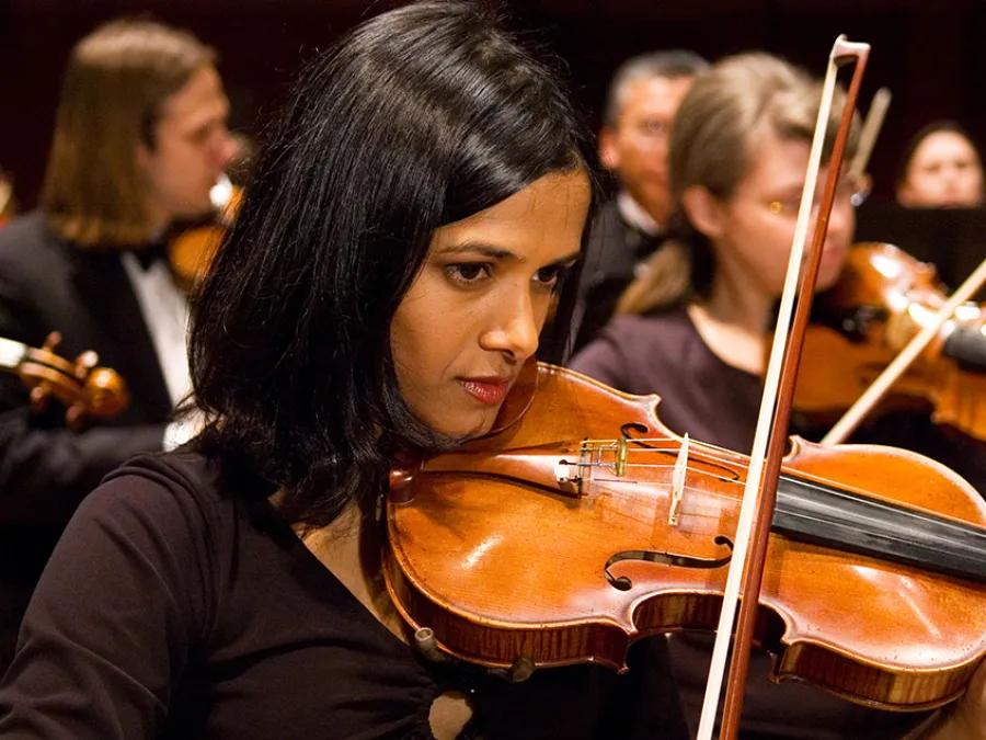 A violinist performs with the Life Sciences Orchestra