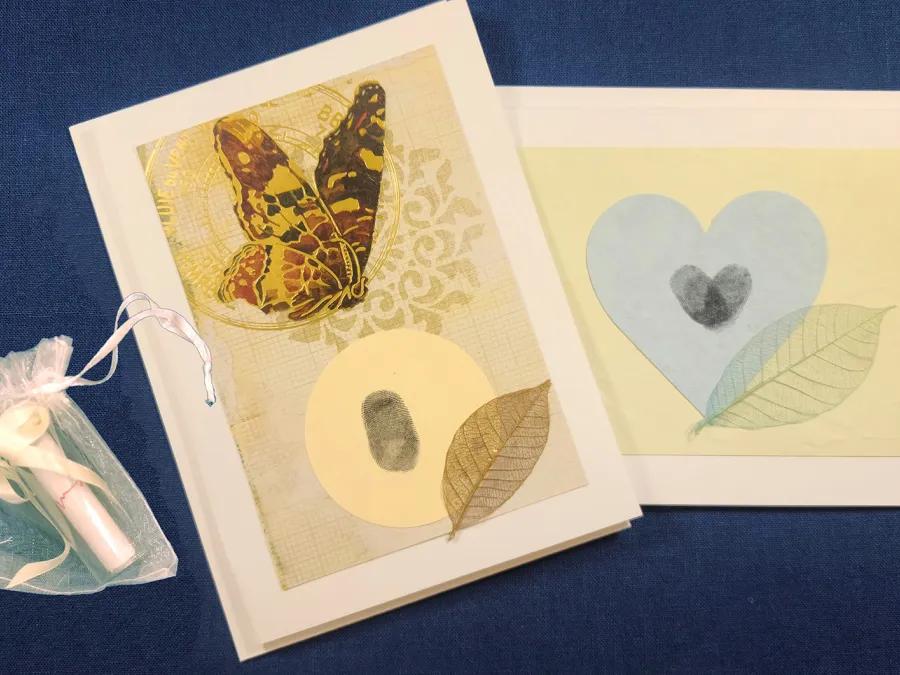 Two cards, one with a butterfly and leaf, one with a heart and leaf