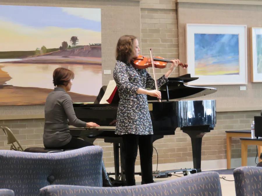 A violist performs with a pianist