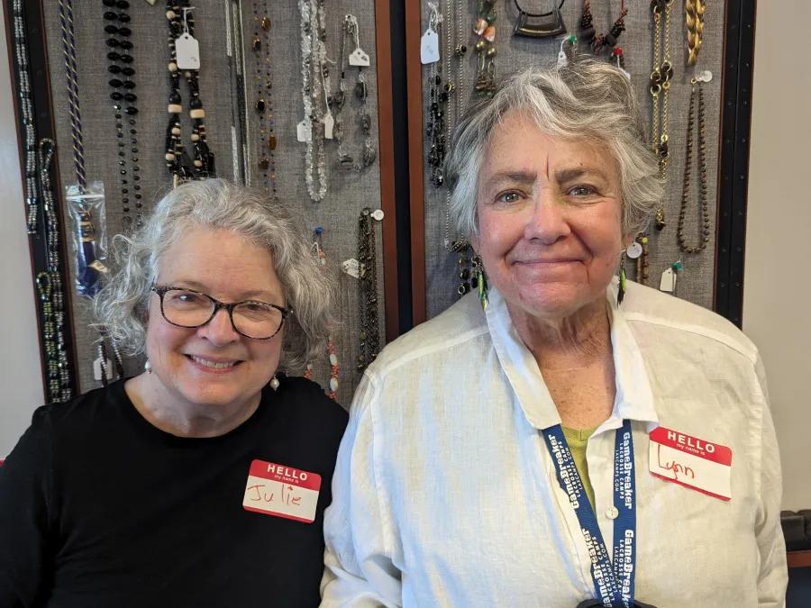 Julie and Lynn volunteer at a jewelry event