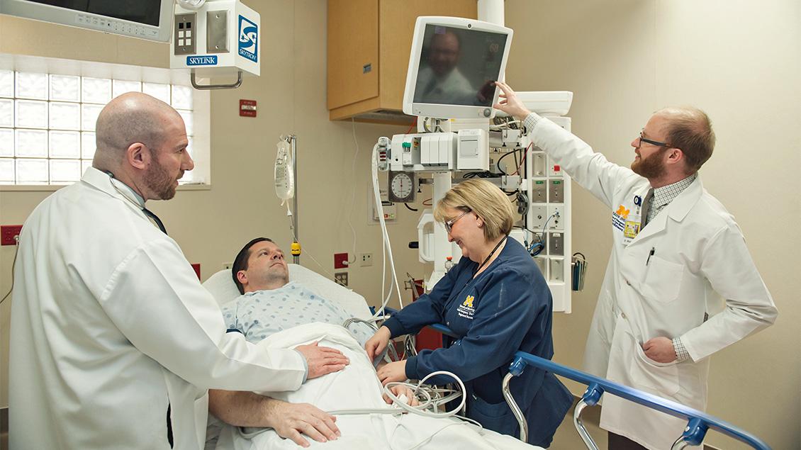 Emergency department personnel with a patient