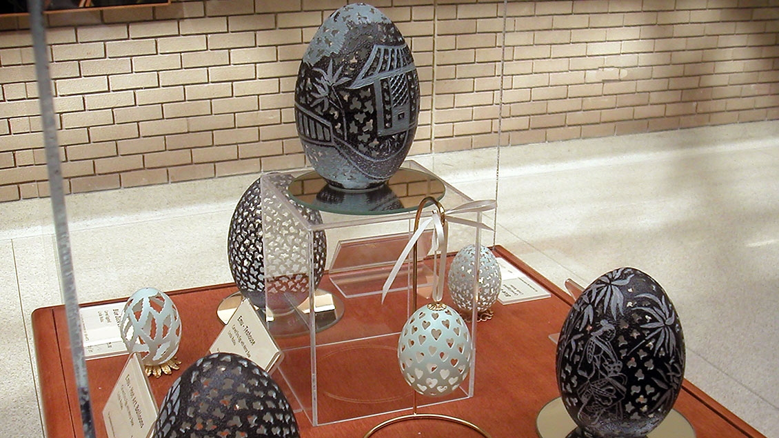 Carved eggs in a display case