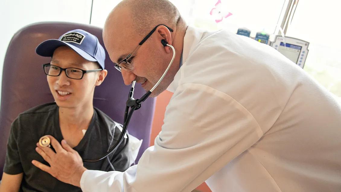 Medical professional next to patient 