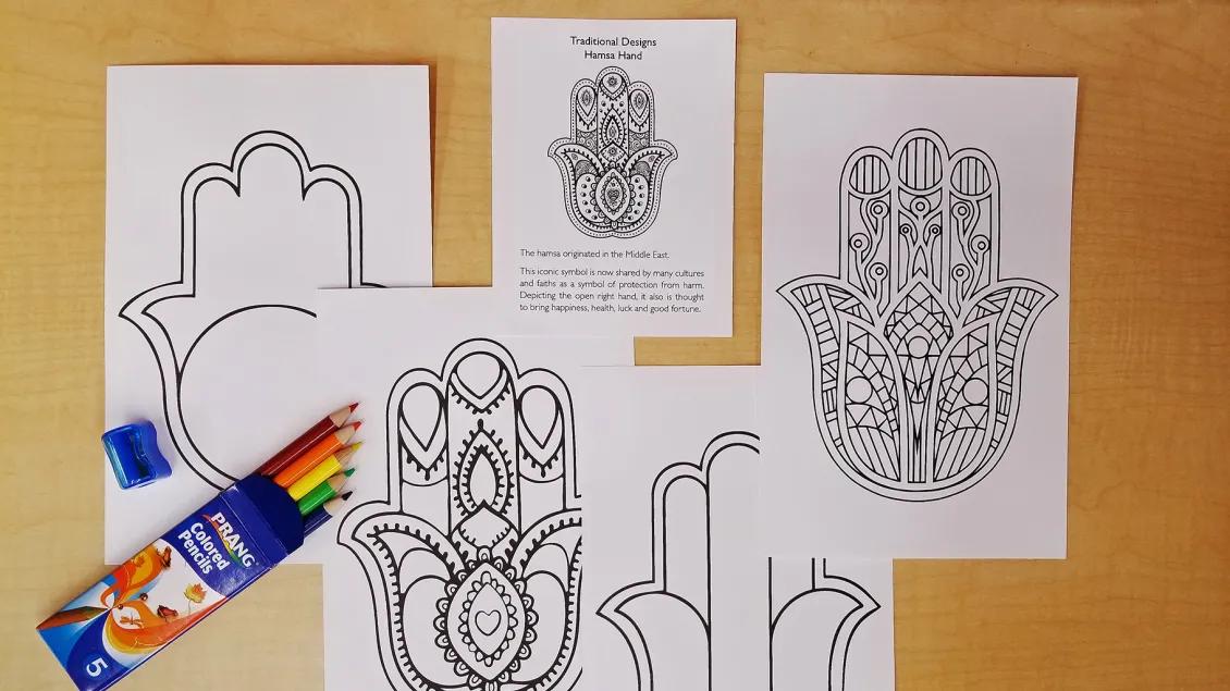 Coloring pages of Hamsa Hands with a package of colored pencils