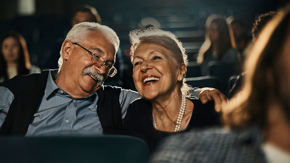 Senior couple sitting in a theater