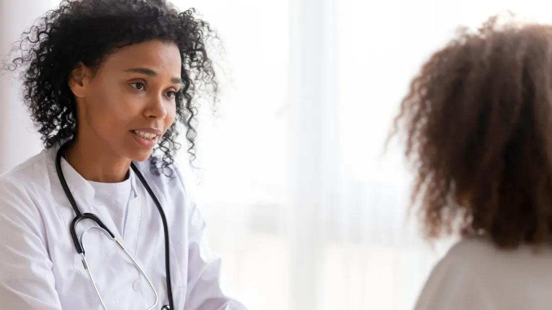 Provider and a young person engaged in conversation