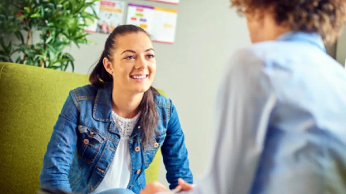 Teen girl speaks with provider