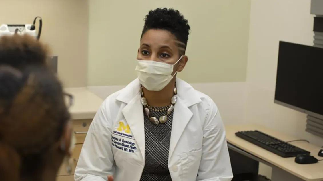 Dr. Versha Pleasant talking with a patient