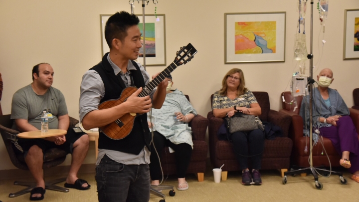 Guitarist Jake performs at the hospital