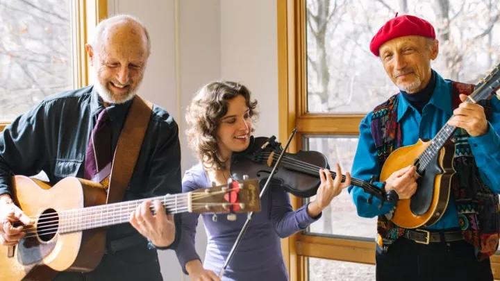 Gemily members pose for a photo with their string instruments