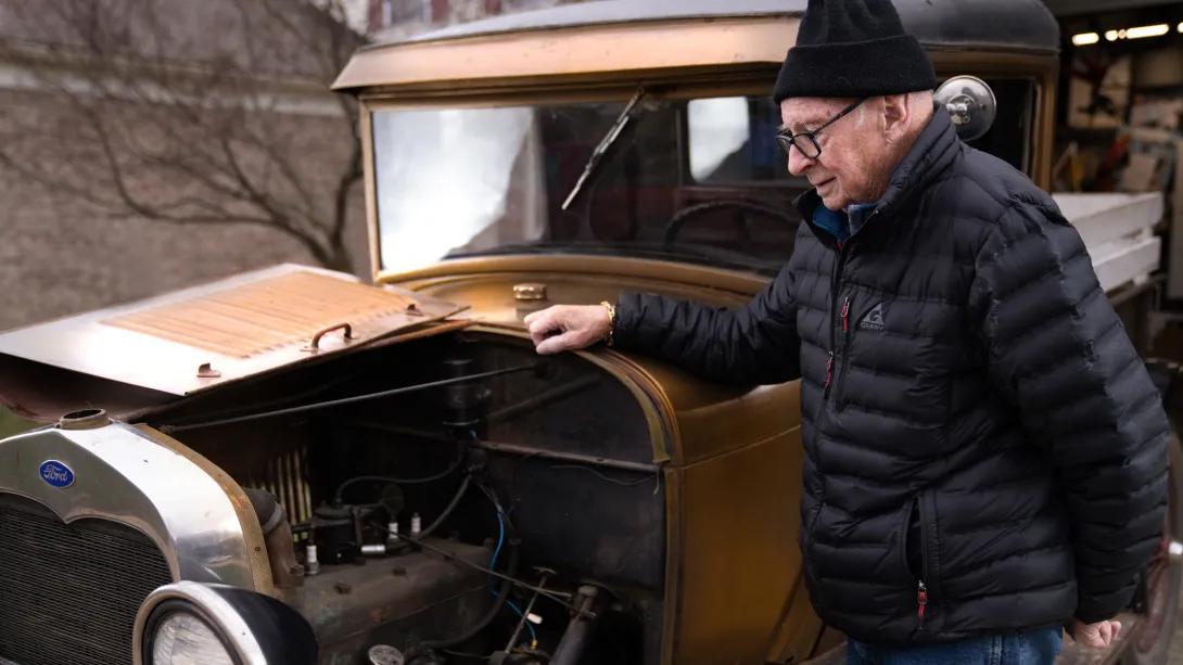 man at front of car