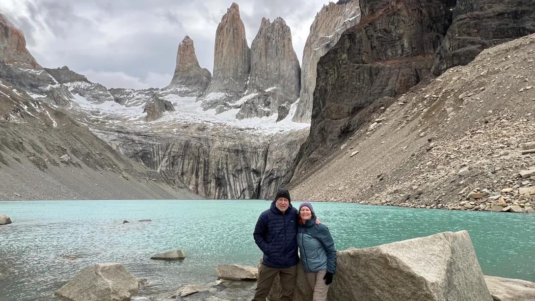 outside hiking infront of blue water