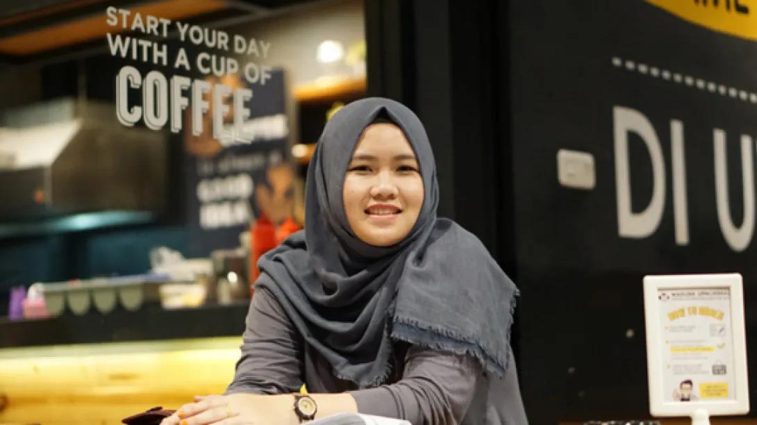 Teen girl in hijab smiles