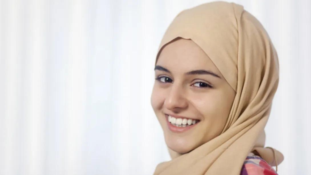 teen girl in hijab smiles
