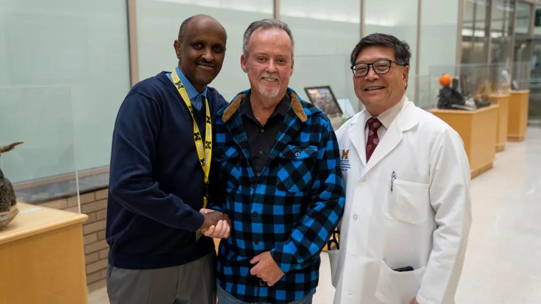 three men standing together