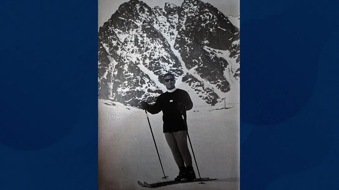 man skiing old photo in back and white by mountain