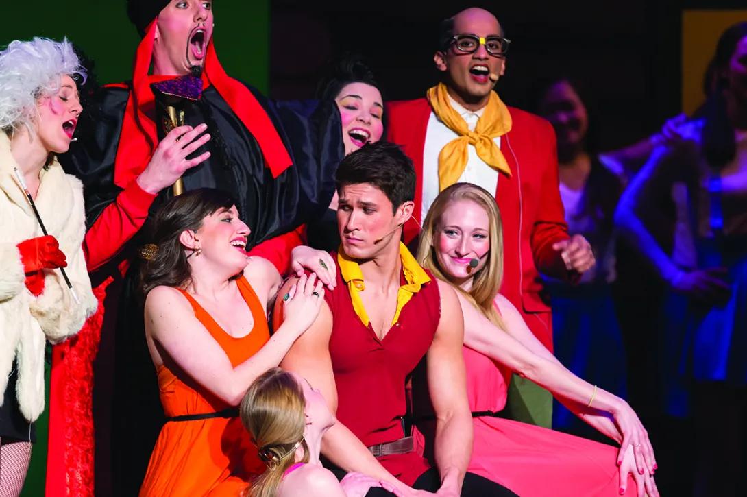Students dressed as characters from Beauty in the Beast perform on stage at the 2015 Galens Smoker show, "Bruit and the Beast."