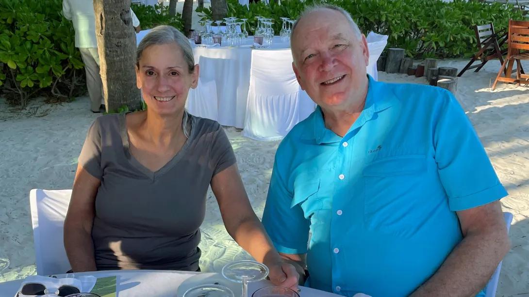 wife and husband together smiling at camera