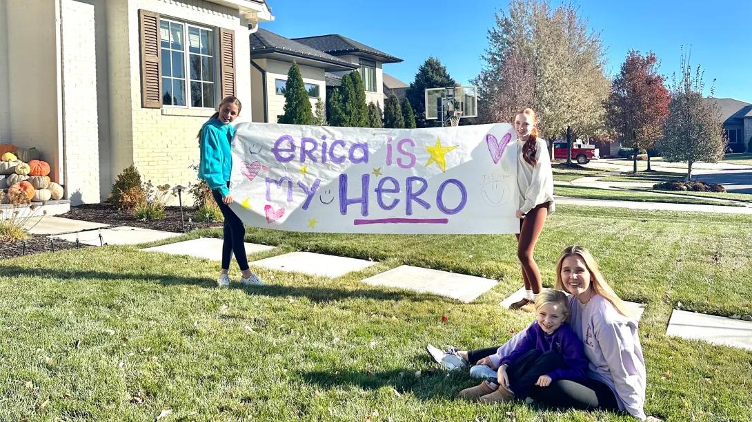 Family holding hero sign for transplant donor