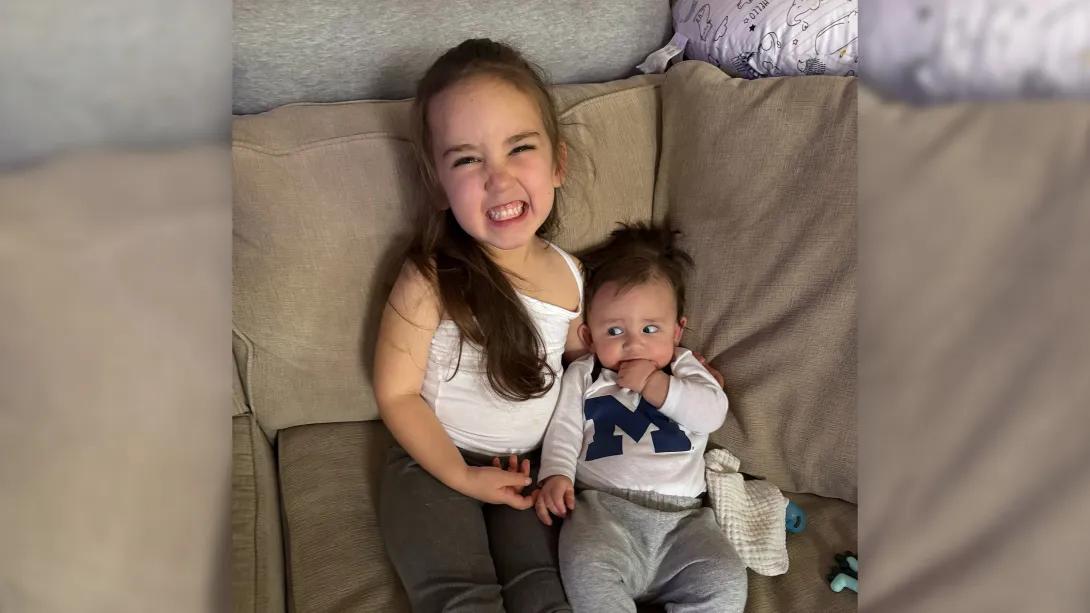 kids smiling on couch