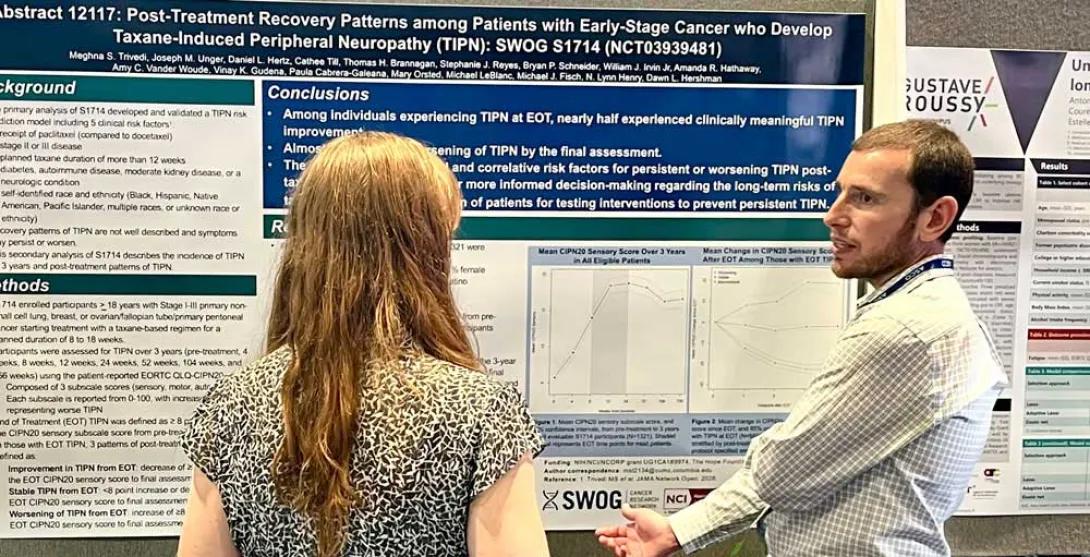 Daniel Hertz, PhD stands in front of his poster at ASCO 2026