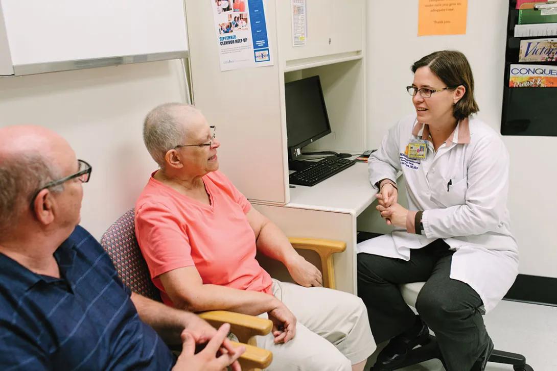 Woman with her husband talking to a provider